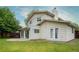 This home's exterior showcases a spacious backyard, patio, and multiple doors for seamless indoor-outdoor living at 7328 S Kit Carson St, Centennial, CO 80122