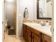 Bathroom showcasing a stylish vanity, sink, and a shower with decorative curtain at 7328 S Kit Carson St, Centennial, CO 80122