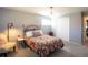 Bedroom with a chandelier, neutral colors, and a large bed at 7328 S Kit Carson St, Centennial, CO 80122