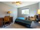 Comfortable bedroom featuring a ceiling fan and a sunny window for natural lighting at 7328 S Kit Carson St, Centennial, CO 80122