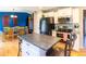 Well-equipped kitchen featuring modern appliances, a central island, and ample cabinet space at 7328 S Kit Carson St, Centennial, CO 80122