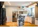Spacious kitchen featuring an island with seating and a seamless flow to the living spaces at 7328 S Kit Carson St, Centennial, CO 80122