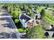 Aerial view of a residential area featuring condos with balconies and extensive tree coverage at 17505 E Mansfield Ave # 1411L, Aurora, CO 80013