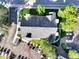 A stunning top-down shot of the building with parking area, landscaping, and dark asphalt shingles at 17505 E Mansfield Ave # 1411L, Aurora, CO 80013