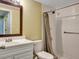 Functional bathroom with a white vanity, a standard toilet, and a walk-in shower with a curtain at 17505 E Mansfield Ave # 1411L, Aurora, CO 80013