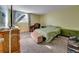 Comfortable bedroom with a soft carpet, a large window, and ample closet space at 17505 E Mansfield Ave # 1411L, Aurora, CO 80013
