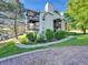 Exterior shot showcases this well-maintained building with mature landscaping and a parking area at 17505 E Mansfield Ave # 1411L, Aurora, CO 80013