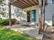 Covered patio area with sliding glass doors leading inside and a grassy area surrounding it at 17505 E Mansfield Ave # 1411L, Aurora, CO 80013