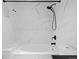 Contemporary bathroom featuring a shower and bathtub with black fixtures and marble tiling at 891 14Th St # 2314, Denver, CO 80202