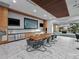 Large common area with a long table, chairs, and a refreshment area with stainless steel appliances at 891 14Th St # 2314, Denver, CO 80202