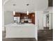 Open-concept kitchen features stainless steel appliances and an island with a sink at 891 14Th St # 2314, Denver, CO 80202