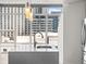 Bright, modern kitchen island with pendant lighting and city views through large windows at 891 14Th St # 2314, Denver, CO 80202