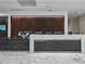 Modern lobby featuring a sleek reception desk, stylish wood slat wall, and contemporary design at 891 14Th St # 2314, Denver, CO 80202