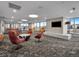 Contemporary lounge area features stylish seating and a large flat-screen TV at 891 14Th St # 2314, Denver, CO 80202