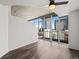 Light-filled bedroom with city views through expansive windows and hardwood-style floors at 891 14Th St # 2314, Denver, CO 80202