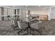 A modern meeting room featuring a large conference table and a kitchenette at 891 14Th St # 2314, Denver, CO 80202