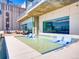 A rooftop pool offers relaxation with stylish lounge chairs partially submerged in the water at 891 14Th St # 2314, Denver, CO 80202