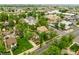 An aerial view of the residential neighborhood with mature trees and walkable streets at 113 S 4Th Ave, Brighton, CO 80601