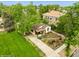 Aerial view of a home featuring lovely landscaping, a beautiful lawn, and a private drive at 113 S 4Th Ave, Brighton, CO 80601