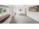 Bonus room featuring neutral walls, painted floors, and natural light at 113 S 4Th Ave, Brighton, CO 80601