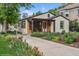 Charming home exterior with colorful flower beds and a cozy front porch at 113 S 4Th Ave, Brighton, CO 80601
