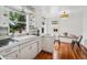 Bright kitchen featuring a retro design, ample natural light, and hardwood floors at 113 S 4Th Ave, Brighton, CO 80601