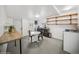 A kitchenette area featuring a breakfast table and chairs, a counter and cabinetry, and a doorway at 113 S 4Th Ave, Brighton, CO 80601
