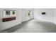 A white-walled living area with a window and door and vintage details, showing bright natural light and neutral colors at 113 S 4Th Ave, Brighton, CO 80601
