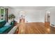 Bright living room showing hardwood floors and arches to other rooms at 113 S 4Th Ave, Brighton, CO 80601