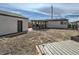 Spacious backyard featuring a detached garage, wooden deck, and ample space for outdoor entertaining at 5050 Steele St, Denver, CO 80216