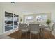 Cozy dining room with sliding door access to the backyard deck and a traditional-style dining table at 5050 Steele St, Denver, CO 80216