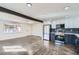 Open kitchen layout with stainless steel appliances, two-tone cabinets, and modern lighting at 5050 Steele St, Denver, CO 80216