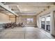 Spacious unfinished basement with concrete floors, exposed ceiling, and sliding door access to the backyard at 18103 House Finch Ln, Parker, CO 80134