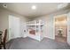 Bedroom with a white bunk bed, bedside table, carpeted floor, and a doorway to an adjacent room at 18103 House Finch Ln, Parker, CO 80134