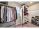 Organized walk-in closet with shelving, hanging rods, drawers, and shoe rack for optimal storage space at 18103 House Finch Ln, Parker, CO 80134