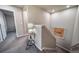 Hallway landing area with decor and carpeted floor at 18103 House Finch Ln, Parker, CO 80134