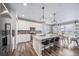 Stylish kitchen with quartz countertops, island seating, and stainless steel appliances at 18103 House Finch Ln, Parker, CO 80134