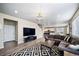 Open concept living room with hardwood floors, access to kitchen and entry at 18103 House Finch Ln, Parker, CO 80134