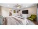 Well lit main bedroom includes a walk-in closet, closet and ceiling fan at 18103 House Finch Ln, Parker, CO 80134