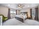 Serene main bedroom with large windows and neutral decor at 18103 House Finch Ln, Parker, CO 80134