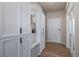 Convenient mudroom features storage cabinets and bench, ideal for organization at 18103 House Finch Ln, Parker, CO 80134