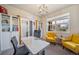 Bright and airy home office with large window and sliding glass door at 18103 House Finch Ln, Parker, CO 80134