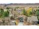 Aerial view of the home in a well-manicured neighborhood with mountain views at 10866 W Half Moon Pass, Littleton, CO 80127