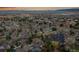 Wide aerial view of neighborhood and community near a town center at 10866 W Half Moon Pass, Littleton, CO 80127