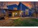 Backyard patio with outdoor dining area, grill, and garden space at 10866 W Half Moon Pass, Littleton, CO 80127