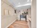 Finished basement featuring open shelving and beverage bar with hardwood floors at 10866 W Half Moon Pass, Littleton, CO 80127