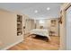 Finished basement with wood floors, a bed, and recessed lighting at 10866 W Half Moon Pass, Littleton, CO 80127