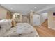 Basement living area featuring wood floors, a bed, a closet and stairs at 10866 W Half Moon Pass, Littleton, CO 80127