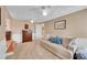 Comfortable bedroom featuring a large sofa at 10866 W Half Moon Pass, Littleton, CO 80127