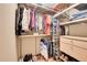 Walk-in closet with custom shelving for organized storage at 10866 W Half Moon Pass, Littleton, CO 80127